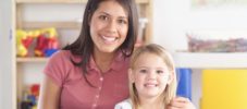 Portrait of a childcare professional and child