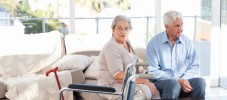 Lovely retired couple talking on the sofa