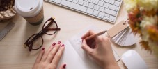 Woman Writing in a Notebook
