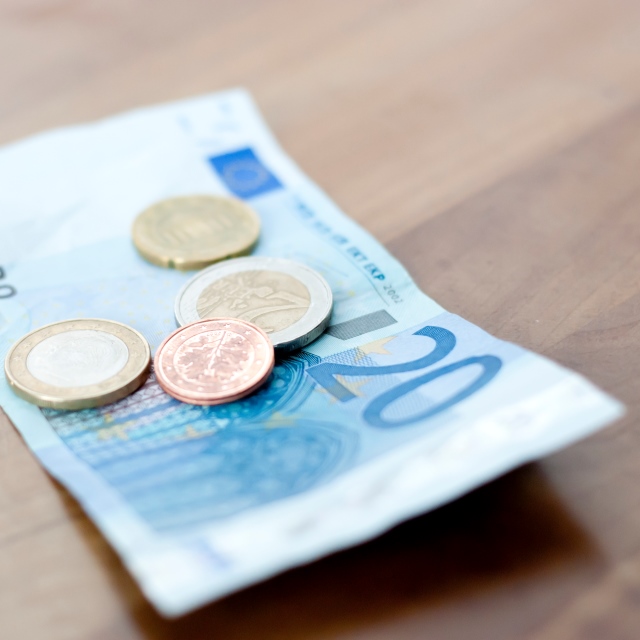 European Currency On Wooden Table