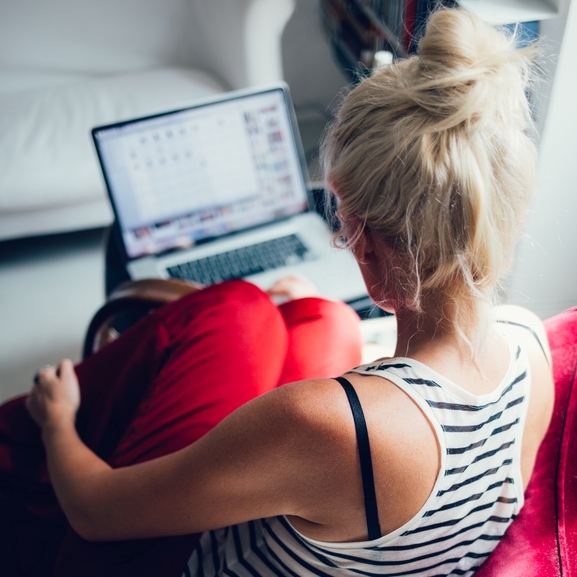 Blonde Woman Using Her Laptop at Home
