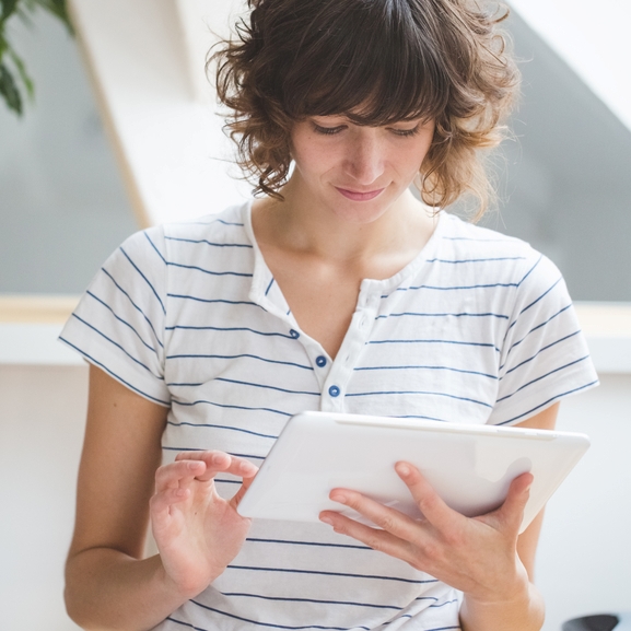 Young woman using digital table.