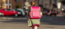 little  girl with a backpack going to school