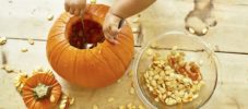 Baby Hands Carving Pumpkin from above